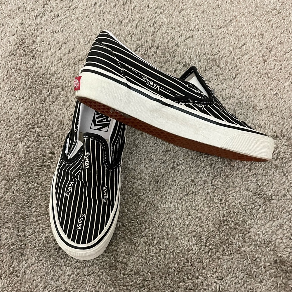Black and White Stripped Slip-on Vans.